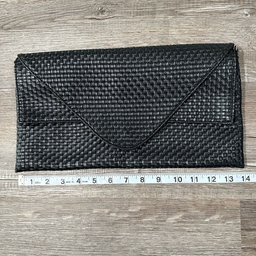 Trendy black faux leather basket weave envelope clutch.